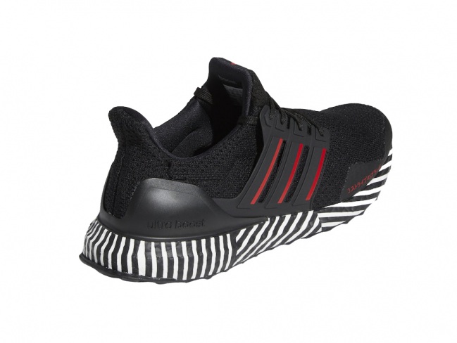 black adidas with red stripes